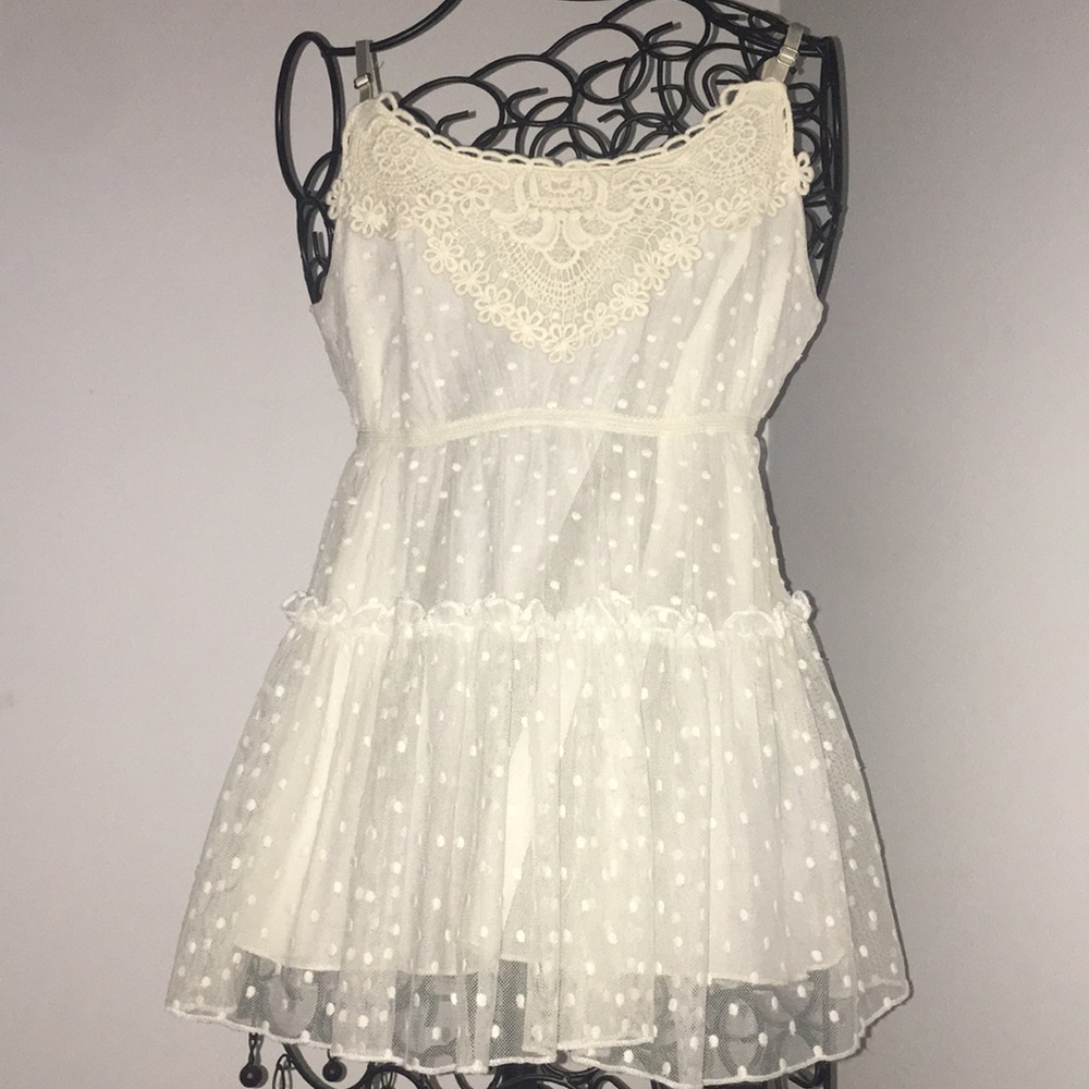 Sheer, slightly off-white top.